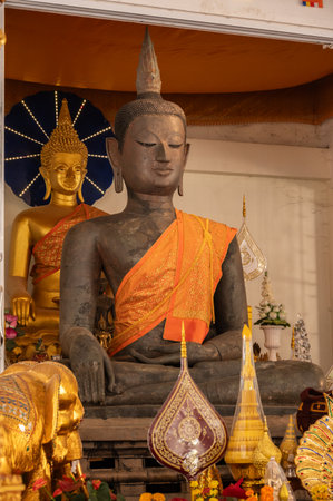 An ancient bronze Buddha statue after discovery and dig it up from island on Mekong river. This Buddha situated at Wat Thong Thip Pattanaram, Laos.の写真素材