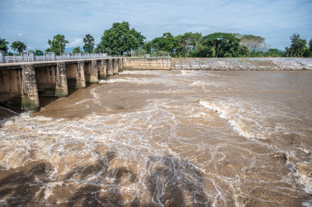 Spillway of Chiang Rai dam open for release water. Spillway, passage for surplus water over or...