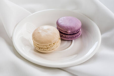 Colorful french macarons on the plate.の写真素材