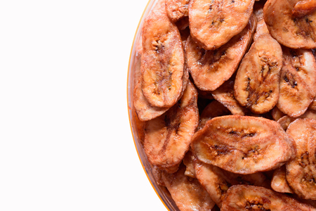 Dried banana slices isolated on white backgroundの写真素材