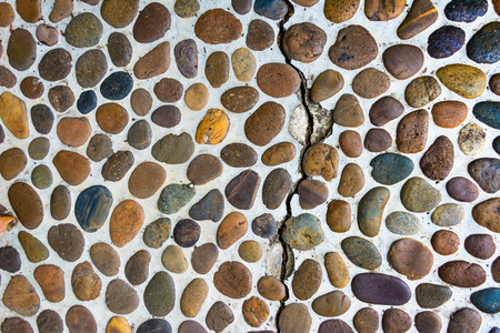Lot of pebbles around big stoneの写真素材