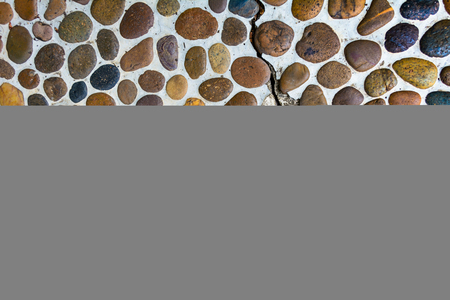 Lot of pebbles around big stoneの写真素材