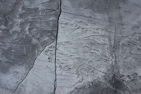 Grunge concrete cement wall with crack in industrial building, great for your design and texture backgroundの写真素材
