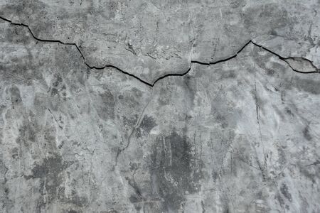 Grunge concrete cement wall with crack in industrial building, great for your design and texture backgroundの写真素材