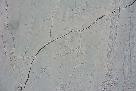 Grunge concrete cement wall with crack in industrial building, great for your design and texture backgroundの写真素材