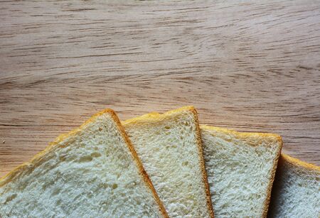 Bread on the wooden floor. wooden backgroundの写真素材