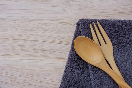 fork and spoon on cloth and wooden  top view.の写真素材