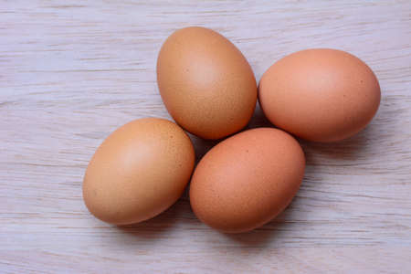 Fresh eggs on wooden backgroundの写真素材