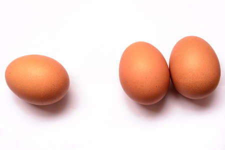 Fresh eggs on white backgroundの写真素材