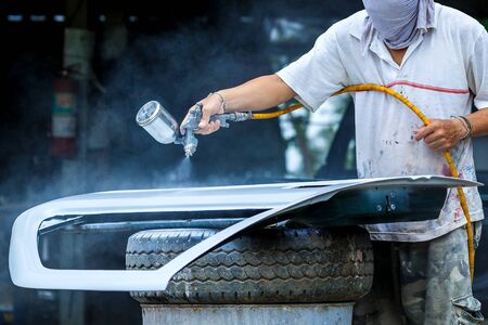 Spray paint car mechanic,Car sprayer,paint repair work.の写真素材