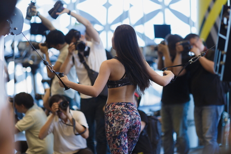 Woman doing muscle training at the gym.のeditorial素材