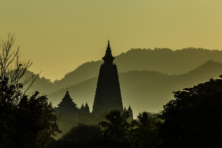 Wat Phra That Phra Dhammakaya Temple, Lampang Pagoda in the mountains Sunshine through the clouds...
