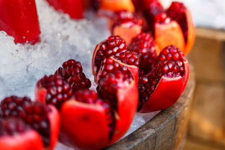 Beautiful red pomegranate on Cold ice.の写真素材