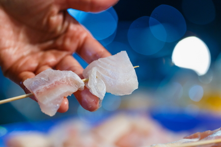 Dolly fish Grill Wooden skewers Prepare to sell Background Bokeh blur.