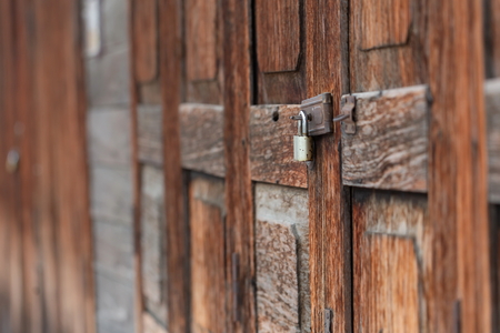 Old wooden background. Wooden table or floor,Wood Texture With Natural Pattern,Old key,Old padlock on a wooden door,Selective focus on the Old key.の写真素材