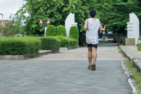 Exercising in the park,jogging and running outdoors in nature,jogging workout wellness concept.の写真素材