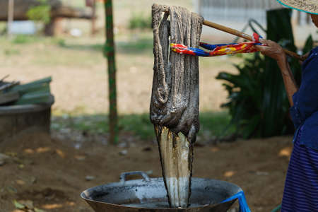 Cotton line dyeing with natural colors,Yarn, raw materials for cotton,Dyeing silk, Using traditional natural materials, Raw multicolored cotton thread,select focus.の写真素材