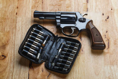 Firearms Revolver on wooden table