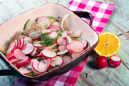 Fresh summer salad   Cucumber, Radish and sliced onion salad   Light healthy fare の写真素材