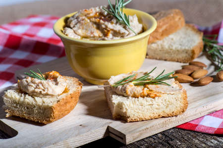 Fresh baked bread with bean and almond spread pate.