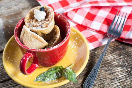 Small Apple Pie Tarts stacked in a cup for dessertの写真素材