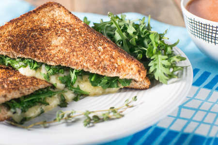 Grilled cheese with argula and fresh tymeの写真素材