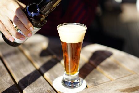 Beer pours on the terraceの写真素材