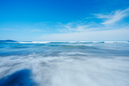 Beautiful seascape with blue sky and white clouds. Long exposure.の写真素材
