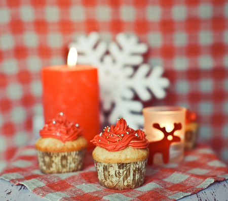 Red wintery cupcakes to celebrate New Year and Christmasの写真素材