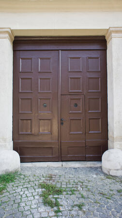 Brown wooden door and geen grassの写真素材