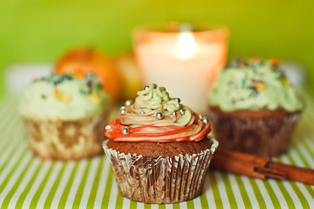 Cupcakes with cinnamon and candleの写真素材