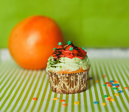 Colored cupcake with orange の写真素材