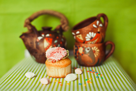 Cupcake with title with candies, cups and kettleの写真素材