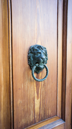 Ancient style carved lion head handle  knocker の写真素材