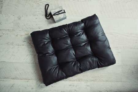 Black pet matress on the wooden floorの写真素材