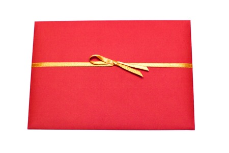 Red envelope with orange ribbon isolated on whiteの写真素材