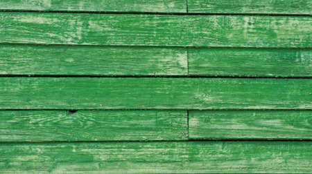 Green obsolete wooden background of the fenceの写真素材