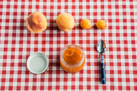 Healthy breakfast  peaches, apricots and tasty jamの写真素材