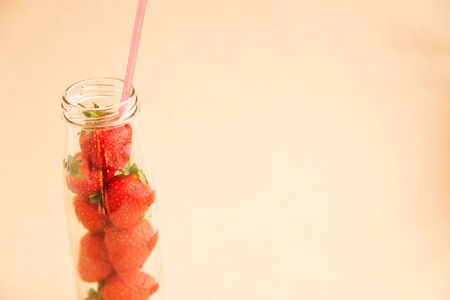Ripe tasty strawberry in the bottleの写真素材