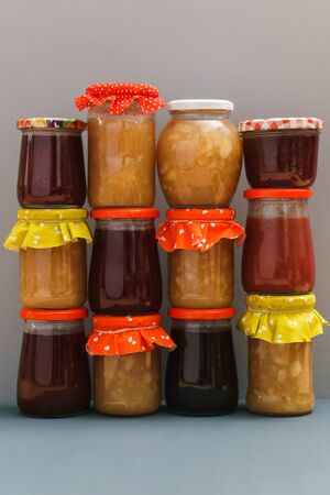 Different jams freshmade by traditional recipe on a grey backgroundの写真素材