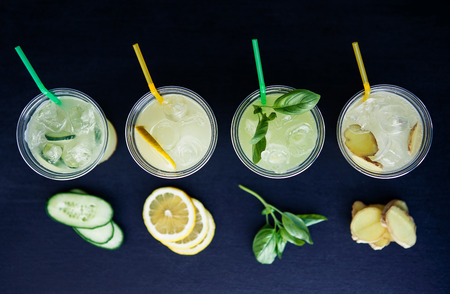 Lemonade with four different tastes on the black backgroundの写真素材