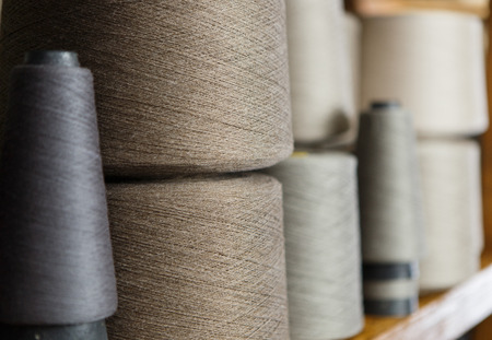 Grey and white skeins on the shelf