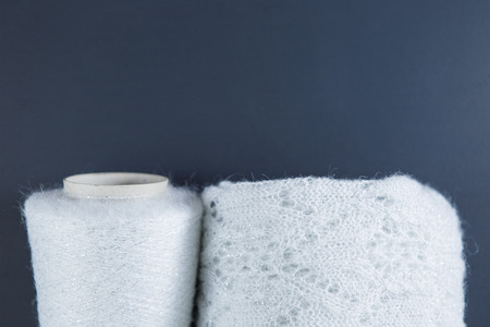White and silver colour skein and textile on the black backgroundの写真素材