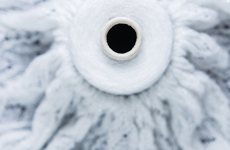 White and silver colour skein on the textile backgroundの写真素材