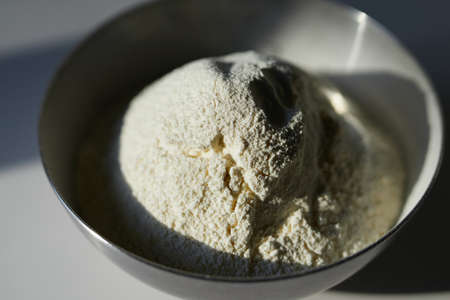 Cookie baking or making Easter pie concept. Hand of man chef in green apron sifting the flour...