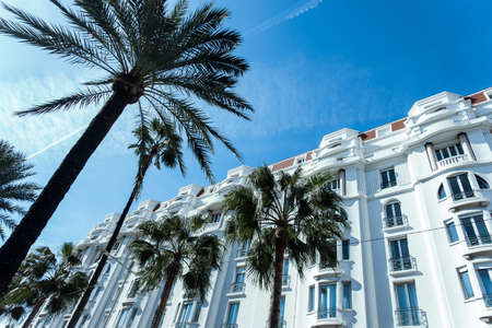 Cannes, France - 16.10.2018: : Hotel Martinez facade in Cannes, France. Martinez is a luxury hotel where many celebrities live when they are in Cannes. High palm trees in front. High quality photoのeditorial素材
