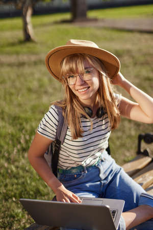 Homeschooling, e-learning, education or surfing concept. Attractive smiling blonde college or...