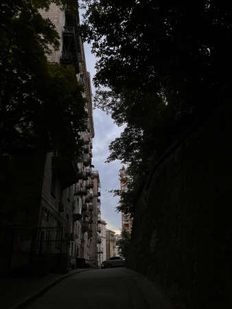 Sunset in city center in Kyiv, Ukraine, yards at Kreschatyk street. Colored sky, dusk, sunset in the city. High quality vertical imageの写真素材
