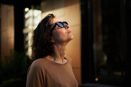 Melancholic beautiful portrait profile. Young adult in the sunglasses. Romantic affecting mood. High quality photoの写真素材