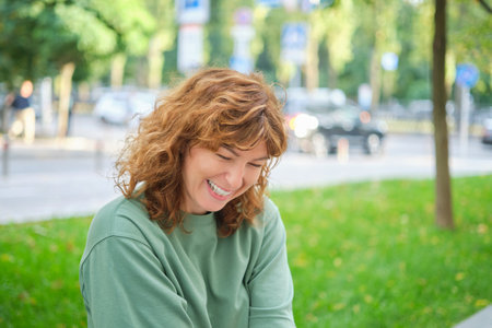 Face, smile and portrait of a woman happy in a park in summer for beauty, excited and confident in nature. garden and female person or model outdoor with freedom, happiness, style. High quality photoの写真素材